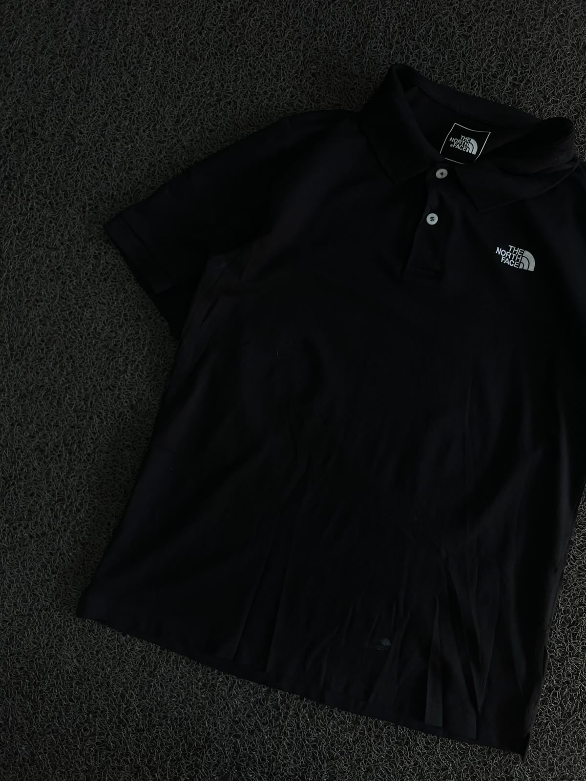 The North Face Black Polo T-Shirt – Classic Outdoor Style