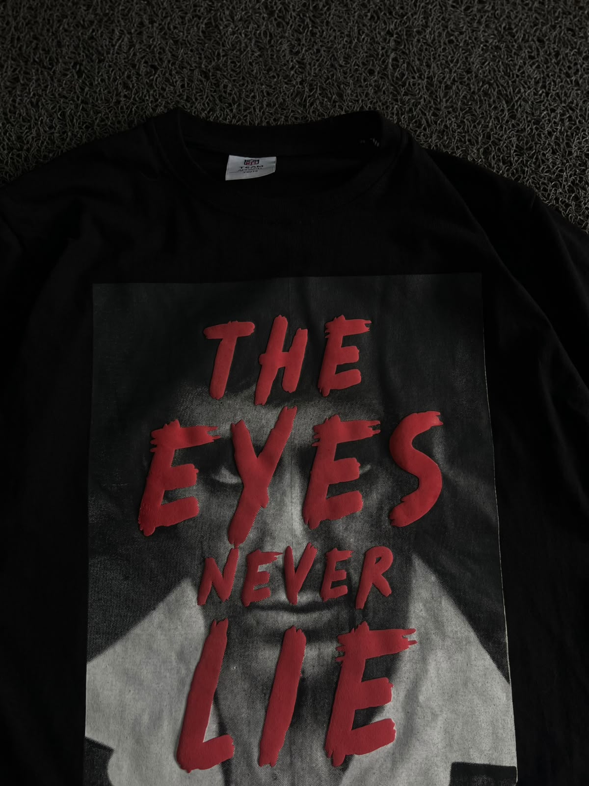 Graphic T-Shirt – "The Eyes Never Lie" Print