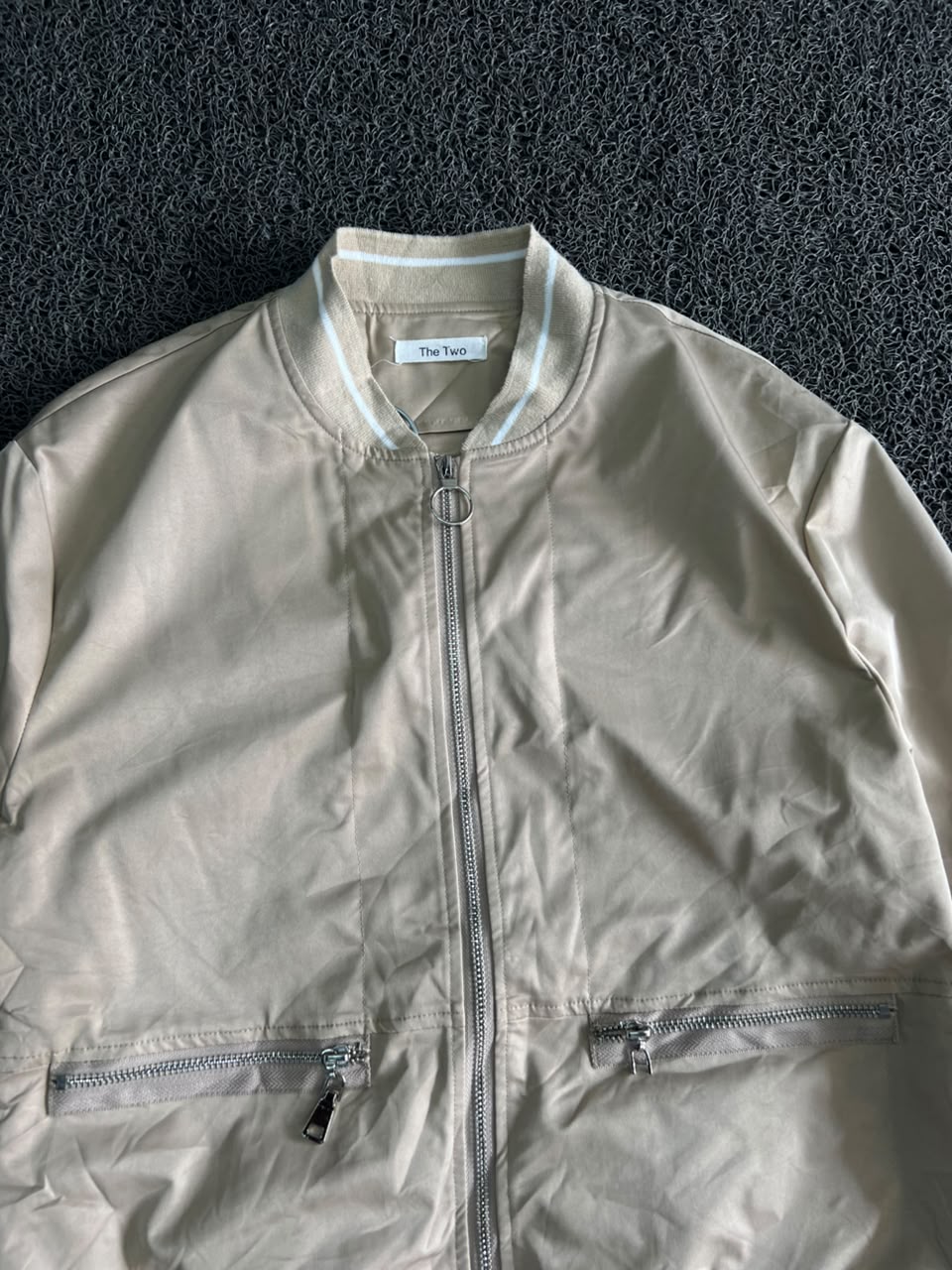 Oversized Beige Bomber with Striped Shirt Hem