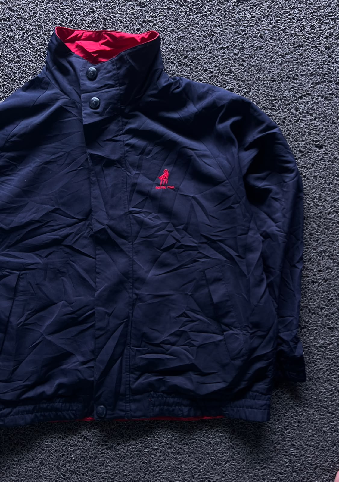 Navy Blue High-Neck Button-Up Jacket with Red Inner Lining and Embroidered Logo