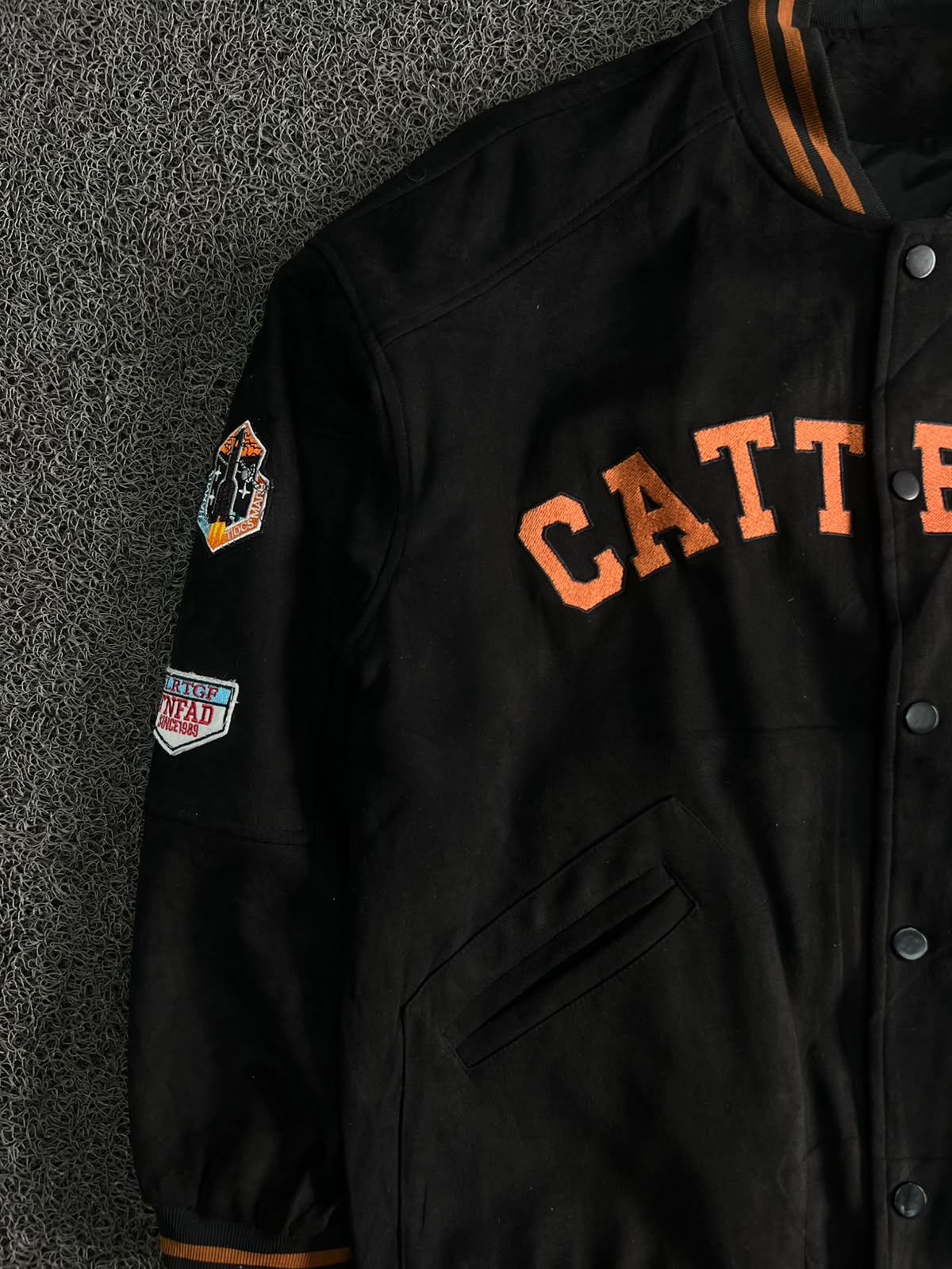 CATT EEINC Black Varsity Snap Jacket – Orange Lettering & Patch Detail