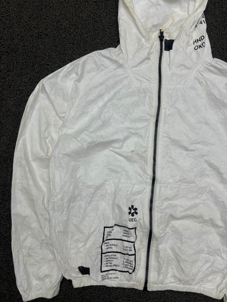UEG White Graphic Hooded Windbreaker Jacket – Lightweight Full Zip Streetwear ⚠️ Small Stain and Damage