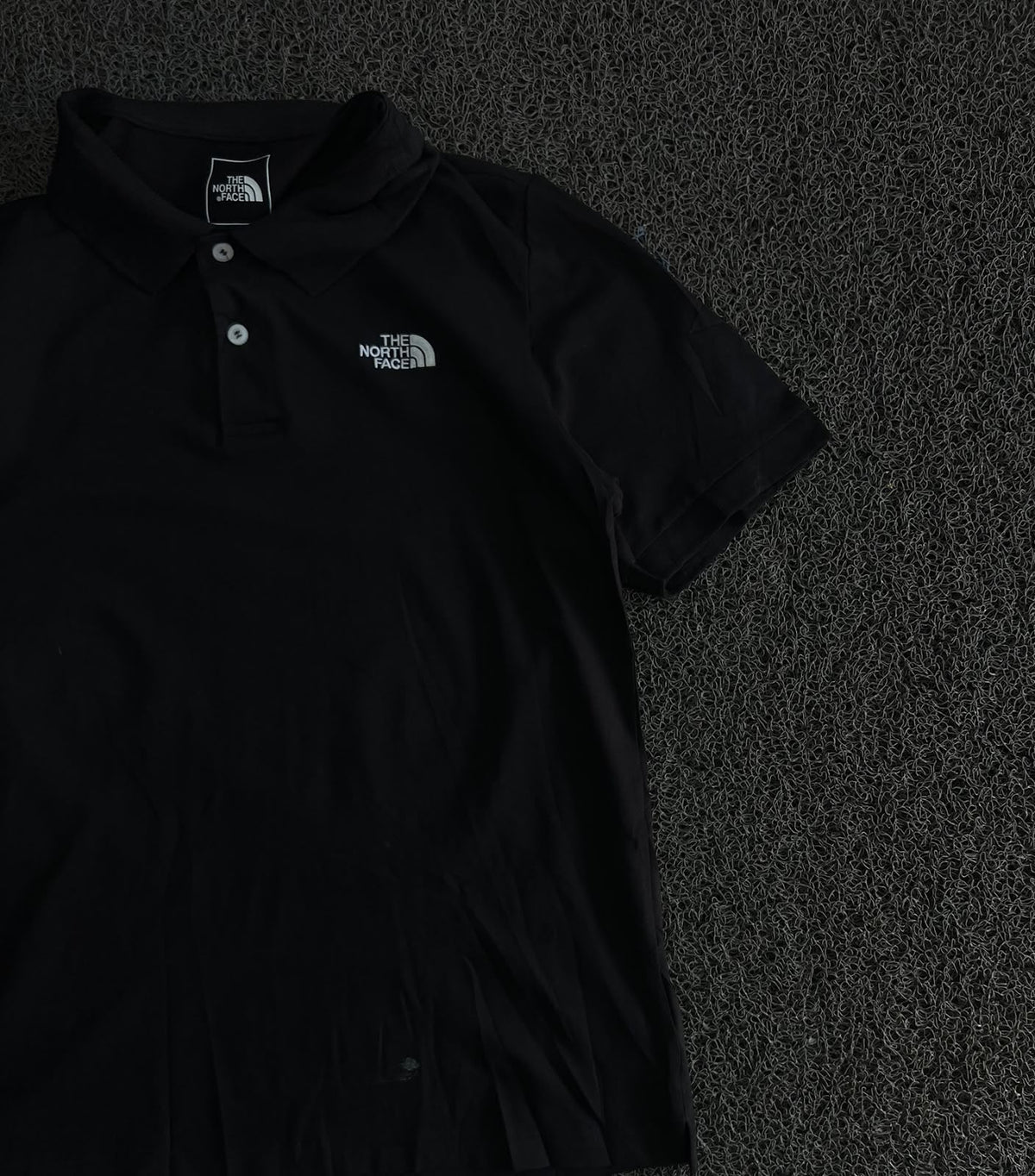 The North Face Black Polo T-Shirt – Classic Outdoor Style