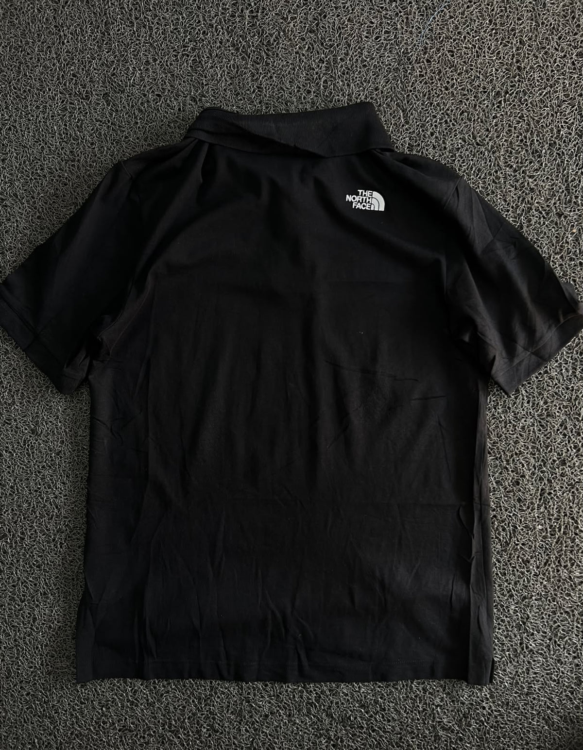 The North Face Black Polo T-Shirt – Classic Outdoor Style