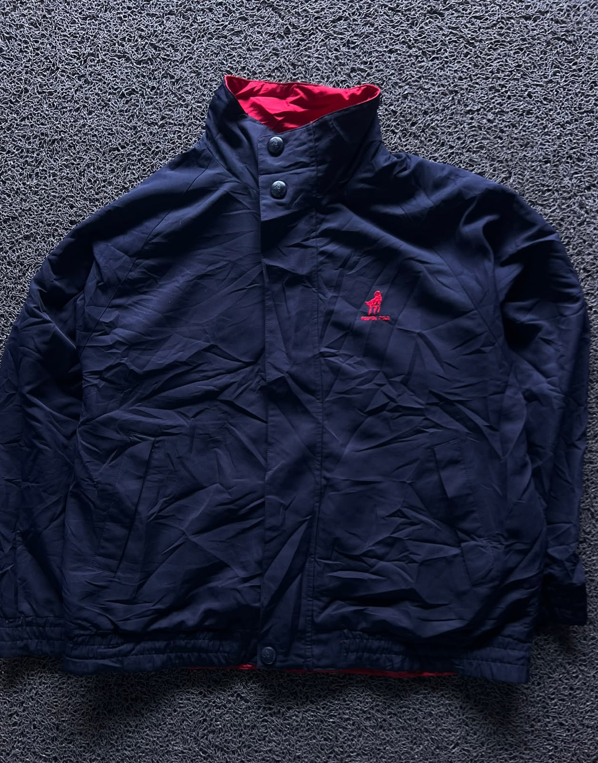 Navy Blue High-Neck Button-Up Jacket with Red Inner Lining and Embroidered Logo