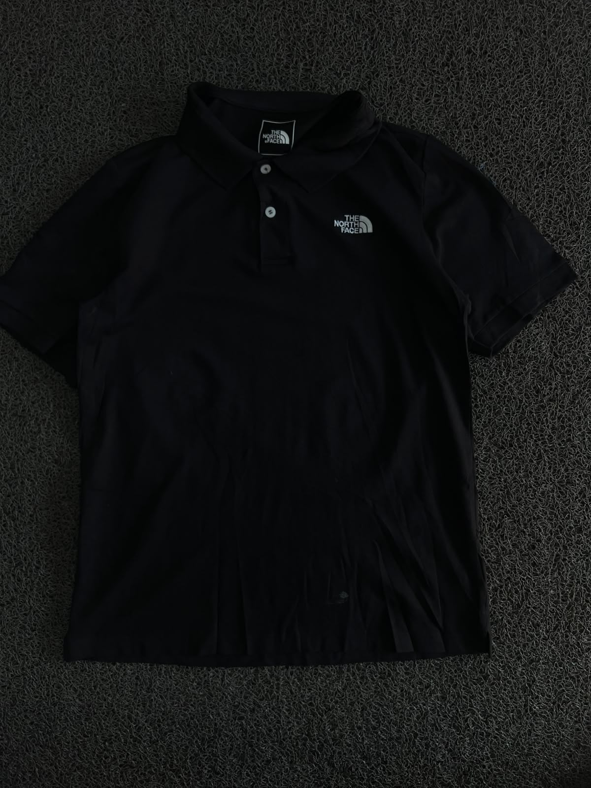 The North Face Black Polo T-Shirt – Classic Outdoor Style