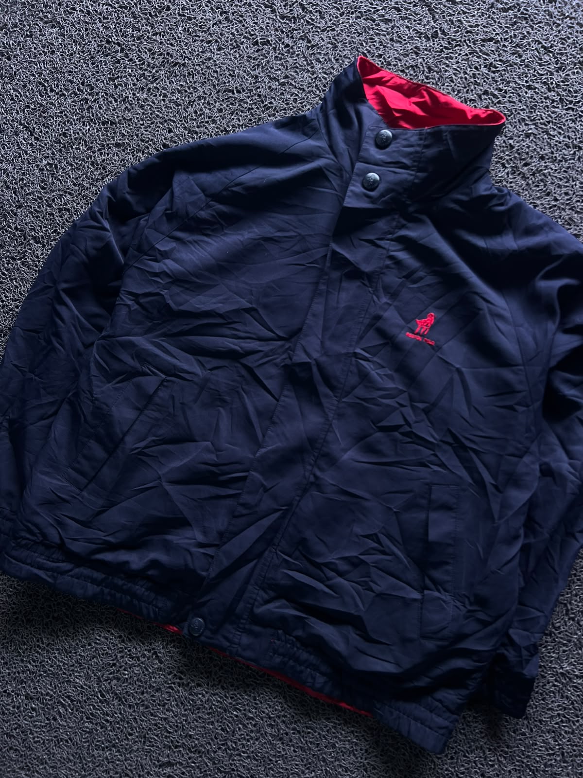 Navy Blue High-Neck Button-Up Jacket with Red Inner Lining and Embroidered Logo